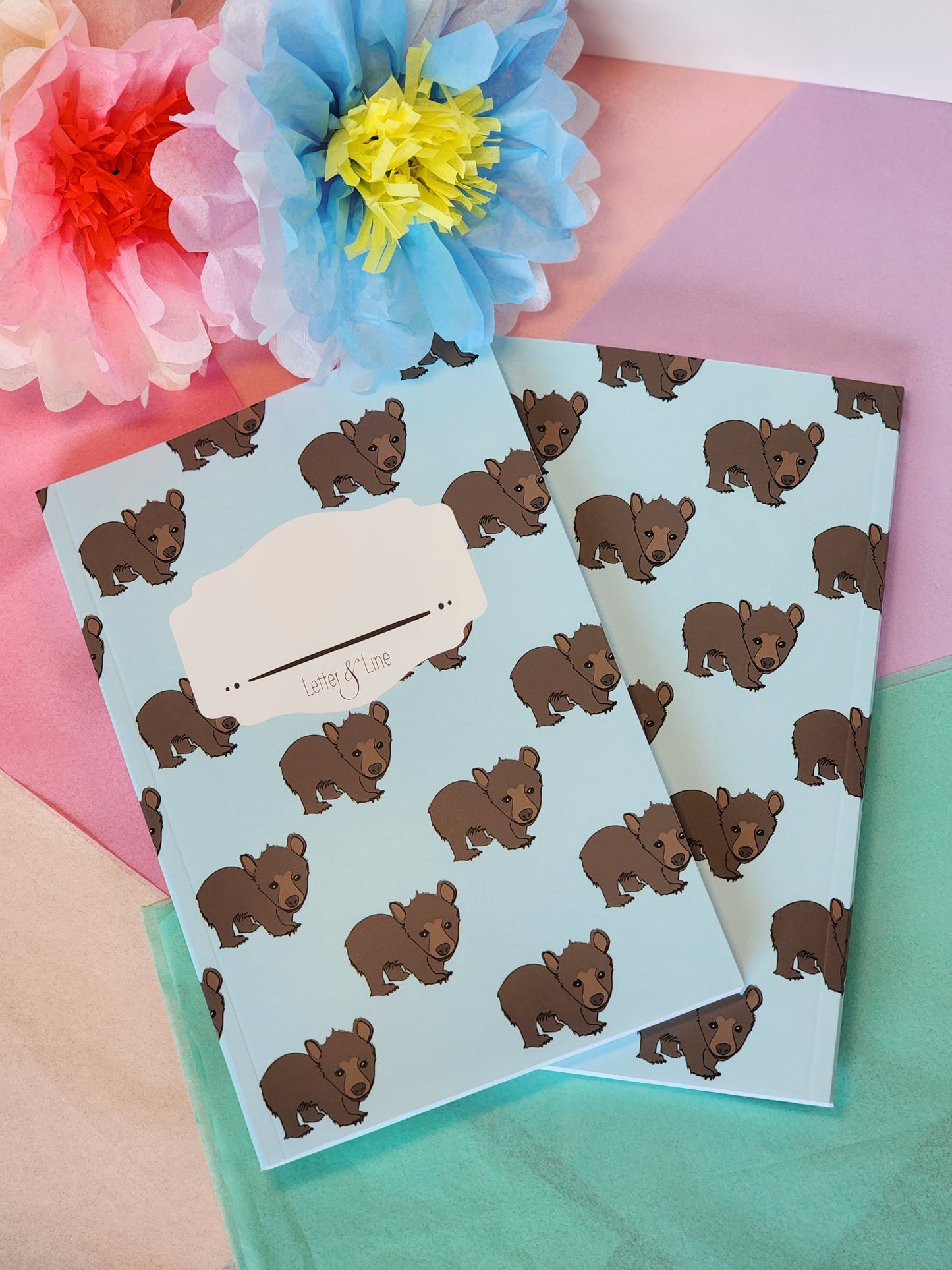 Matching bear notebooks showing front and back covers.
