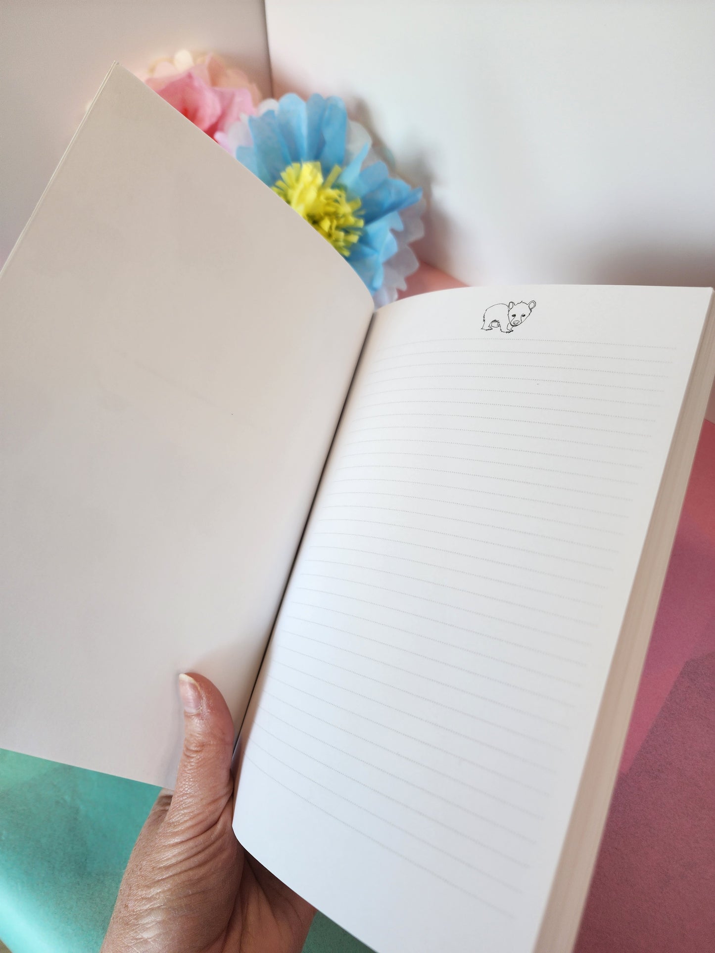 Inside view of bear-themed notebook first page, with lightly lined paper for easy writing and organizing.