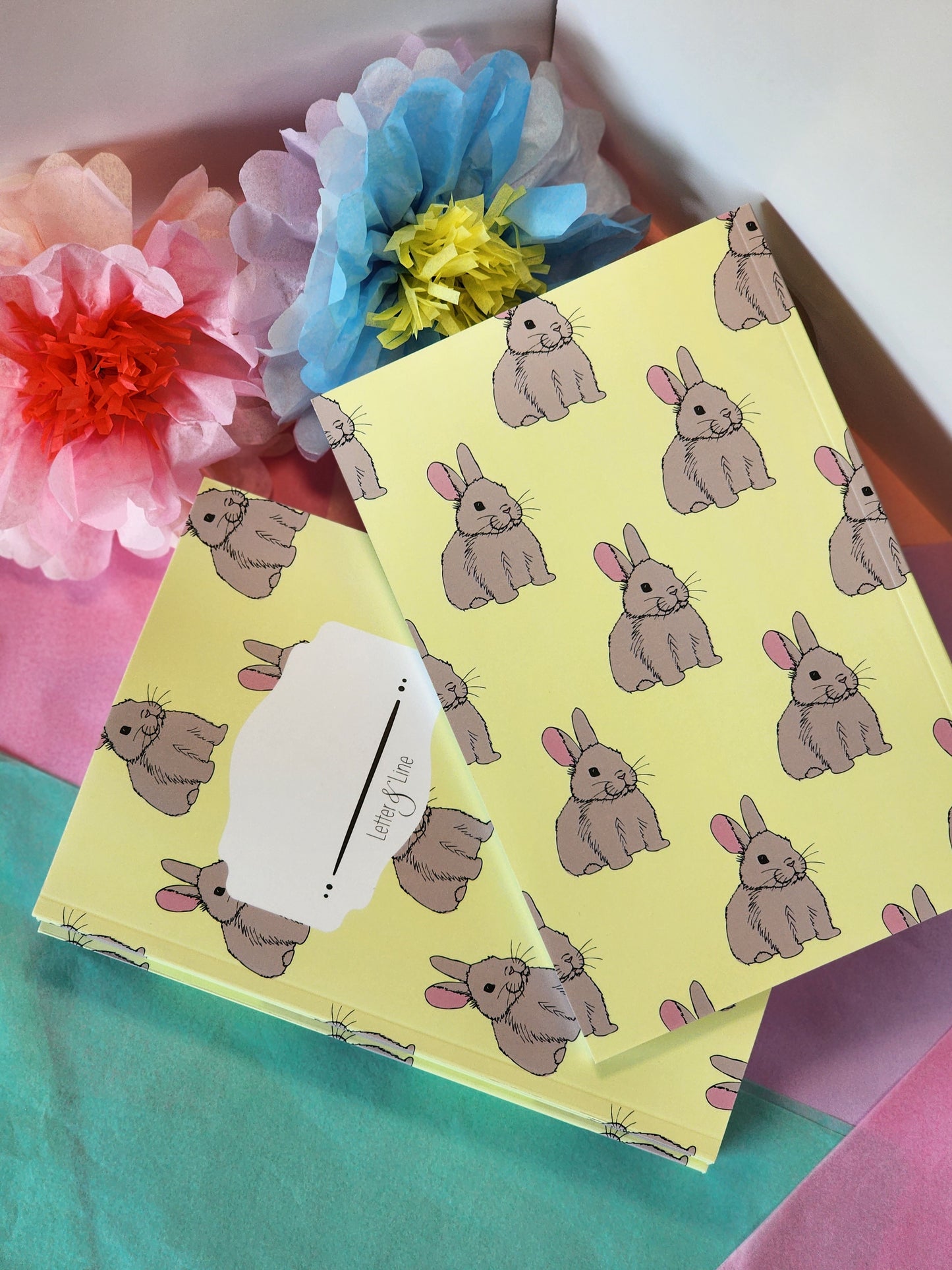 Bunny pattern notebooks showing front and back covers and an all-over repeating rabbit pattern.