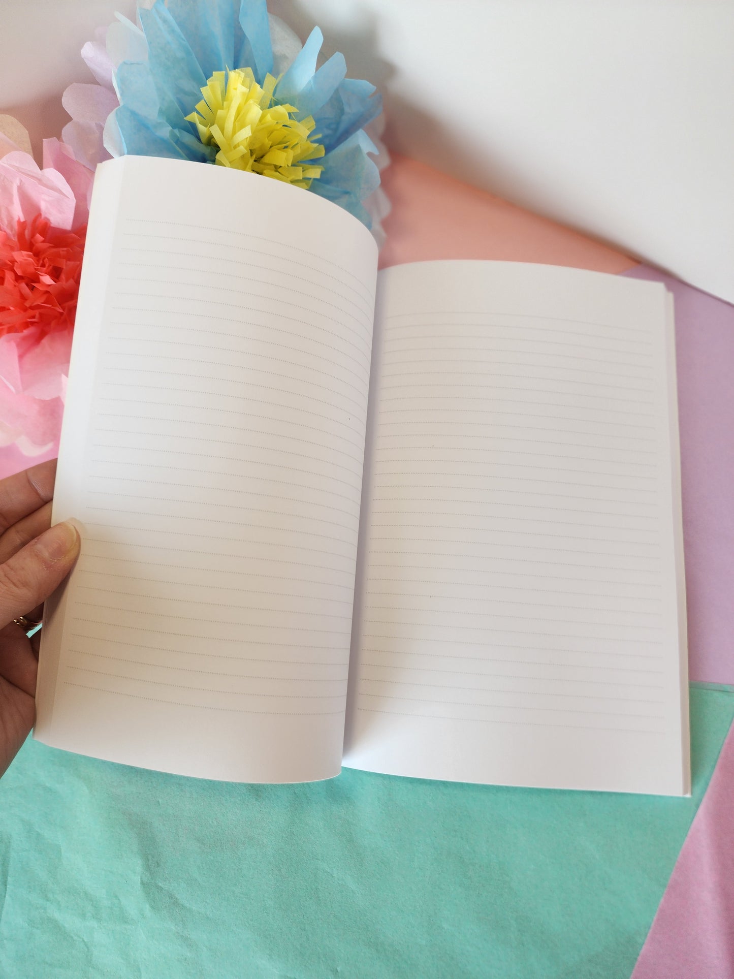 Open bunny journal displaying smooth lined paper, ideal for note-taking or personal journaling.