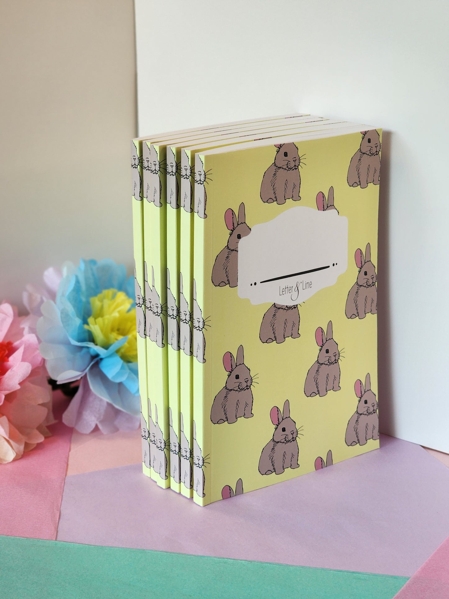 Multiple bunny notebooks stacked together, showcasing soft matte cover and slim design.