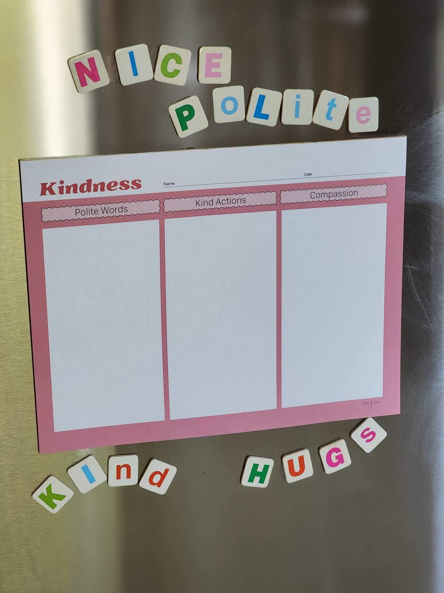 Kindness chart in action on refrigerator, decorated with letter magnets to encourage positive language.