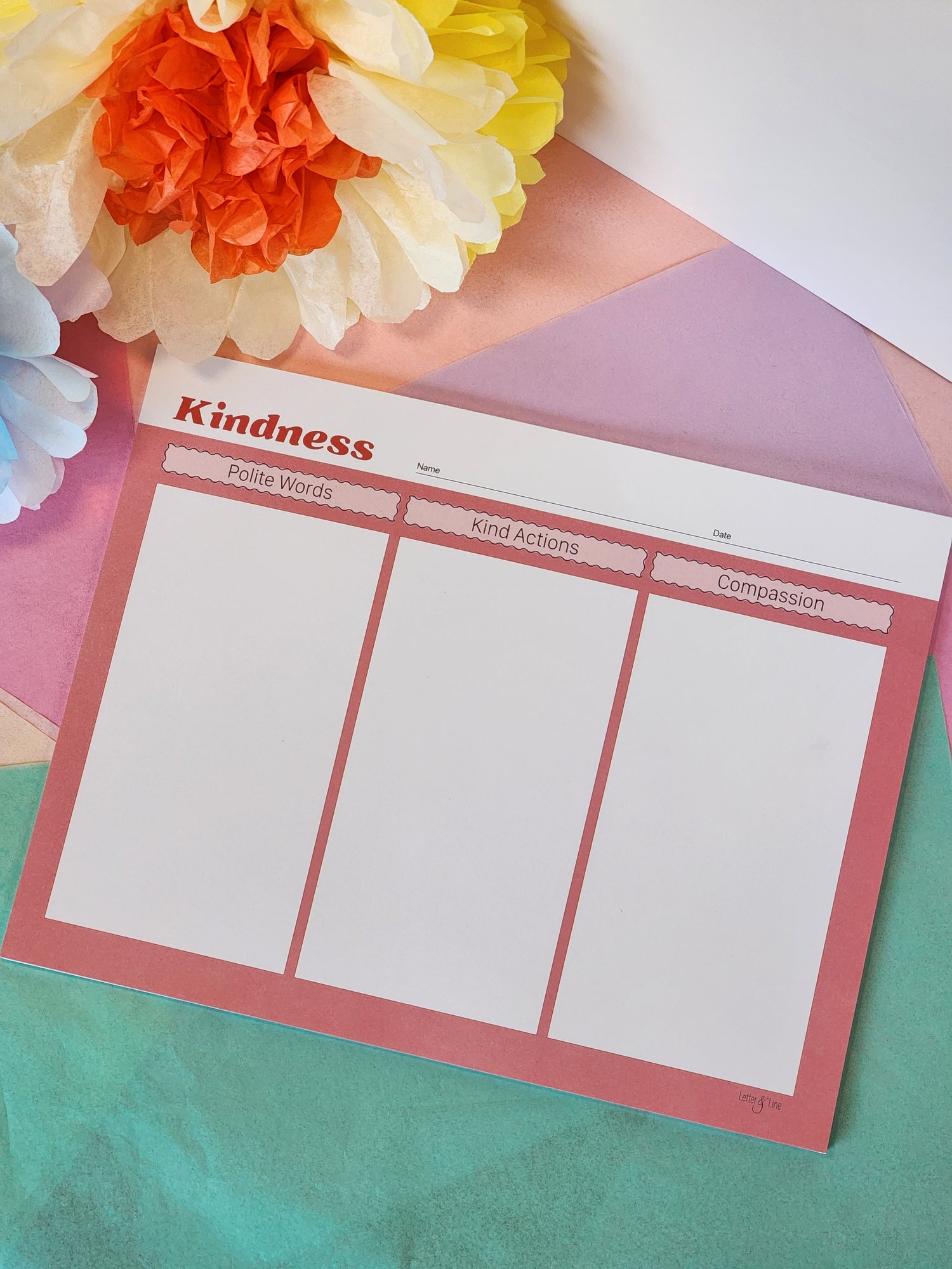 Magnetic kindness chart featuring three columns: polite words, kind actions, and compassion.