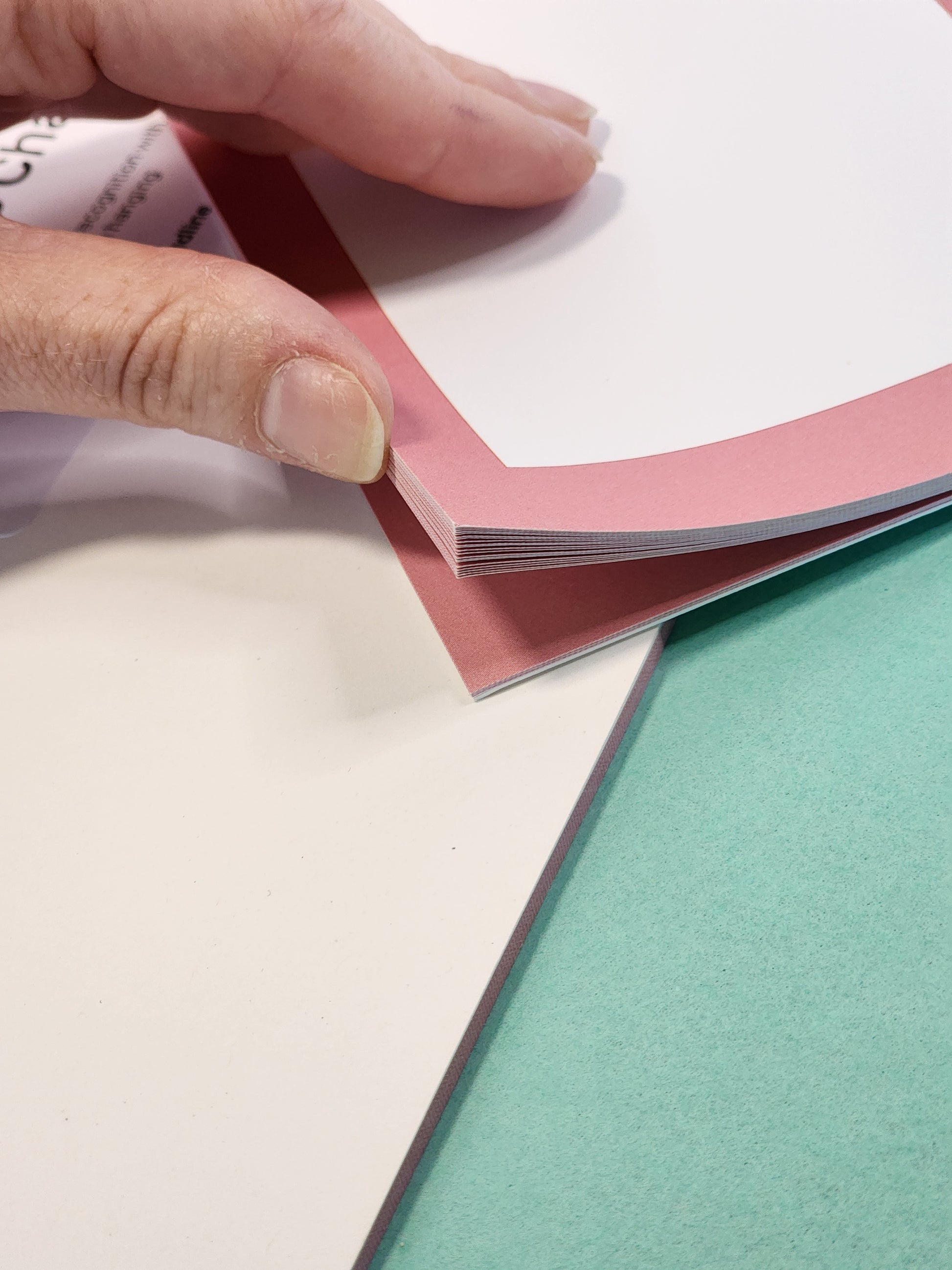 Tear-off kindness chart pages shown in close-up detail.