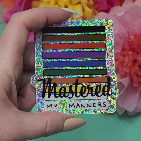 video showing sparkly finish of the mastered my manners sticker