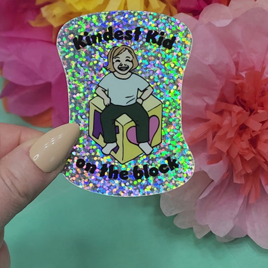 video showing the sparkle finish on the kindest kid on the block sticker