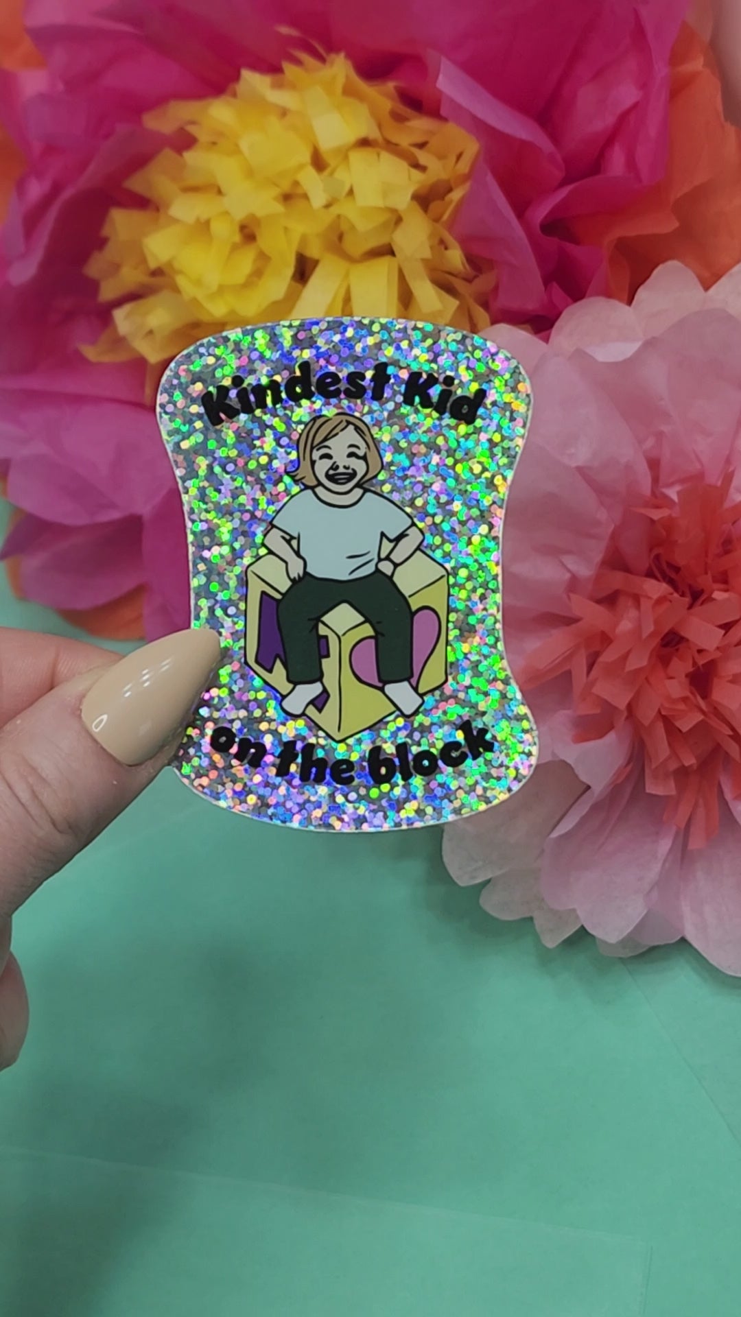 video showing the sparkle finish on the kindest kid on the block sticker